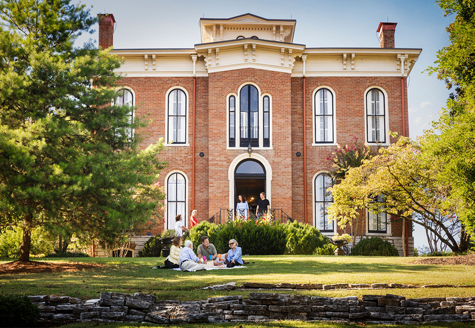 Riverview, people sitting on grass